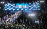 Jewish athletes participating in the 20th Maccabiah Games, wave their national flag during the opening ceremony of the Maccabiah Games in Jerusalem, July 6, 2017. (Yonatan Sindel/Flash90)