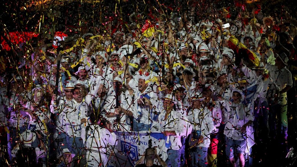 Jewish athletes participating in the 20th Maccabiah Game, wave their national flag during the opening ceremony in Jerusalem on July 6, 2017. (Yonatan Sindel/Flash90) Jewish athletes participating in the 20th Maccabiah Game, wave their national flag during the opening ceremony in Jerusalem on July 6, 2017. (Yonatan Sindel/Flash90)