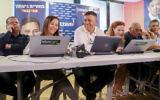 Labor leadership candidate Avi Gabbay, with Labor party members Stav Shaffir and Shelly Yachimovich, make phone calls to potential voters ahead of the second round of the Labor party primaries in Tel Aviv, on July 9, 2017. (Flash90)