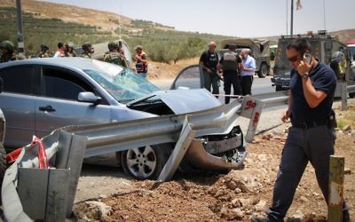 The scene of a car-ramming attack on a highway in the central West Bank on July 10, 2017 (Gershon Elinson/Flash90)