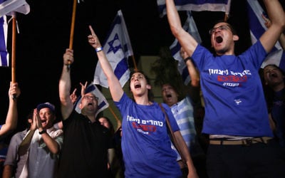 Supporters of Labor party candidate Avi Gabbay in Tel Aviv on July 10, 2017. (Miriam Alster/Flash90) Supporters of Labor party candidate Avi Gabbay in Tel Aviv on July 10, 2017. (Miriam Alster/Flash90)