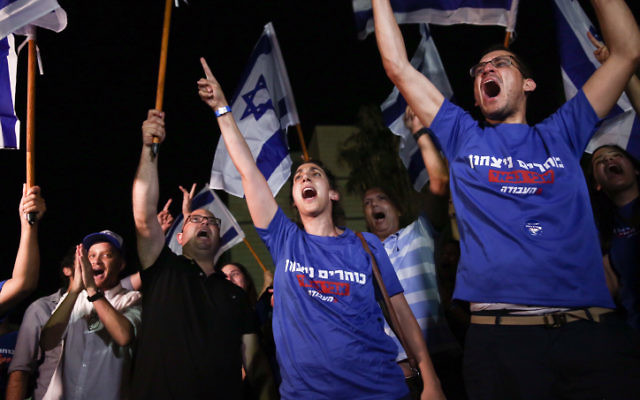 Supporters of Labor party candidate Avi Gabbay in Tel Aviv on July 10, 2017. (Miriam Alster/Flash90) Supporters of Labor party candidate Avi Gabbay in Tel Aviv on July 10, 2017. (Miriam Alster/Flash90)