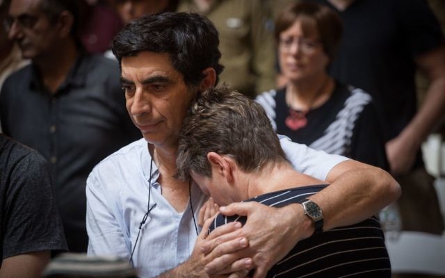 Leah (L) and Simcha Goldin, parents of late Israeli soldier Hadar Goldin, attend a ceremony marking three years since Operation Protective Edge at the National Memorial Hall at the entrance to the military cemetery on Mount Herzl, July 13, 2017. (Hadas Parush/Flash90)