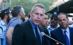 Public Security Minister Gilad Erdan speaks at the funeral of Israeli Druze police officer Kamil Shnaan in the northern village of Hurfeish, July 14, 2017. (Basel Awidat/Flash90)