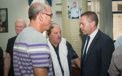 Public Security Minister Gilad Erdan visits the family of Israeli Druze police officer Kamil Shnaan in the northern village of Hurfeish, July 16, 2017. (Awidat/Flash90) Public Security Minister Gilad Erdan visits the family of Israeli Druze police officer Kamil Shnaan in the northern village of Hurfeish, July 16, 2017. (Awidat/Flash90)