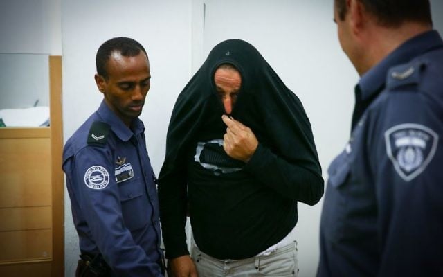 Sami Kara is brought to Lod District Court for an indictment on murdering his own daughter, July 16, 2017. (Flash90) Sami Kara is brought to Lod District Court for an indictment on murdering his own daughter, July 16, 2017. (Flash90)