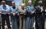 File: Waqf officials and others prepare to pray outside the Temple Mount, in Jerusalem's Old City, rather than enter the compound via metal detectors set up by Israel following a terror attack, July 16, 2017. (Yonatan Sindel/Flash90)