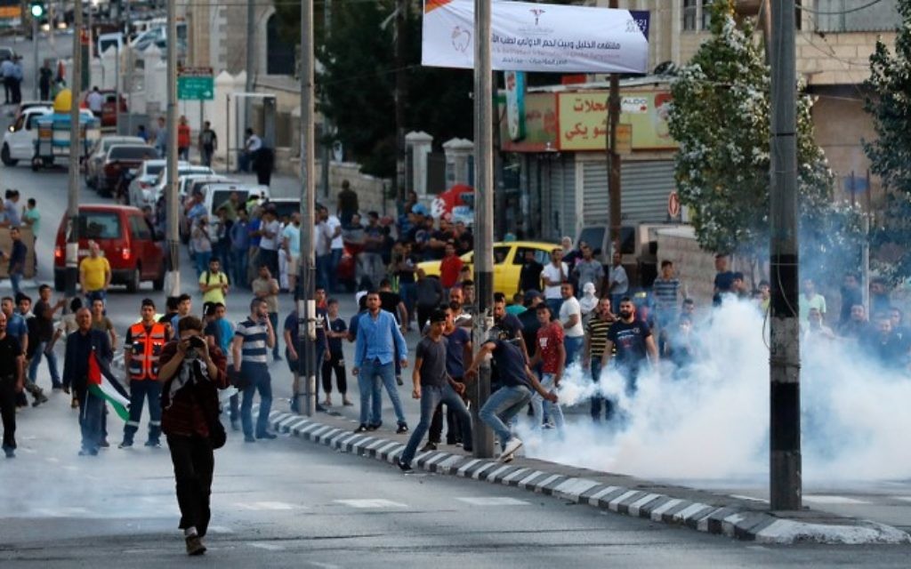 Israeli police clash with Palestinian protesters during a protest against metal detectors that were placed at gates to the Temple Mount, in the West Bank city of Bethlehem on July 19, 2017. (Wisam Hashlamoun/Flash90) Israeli police clash with Palestinian protesters during a protest against metal detectors that were placed at gates to the Temple Mount, in the West Bank city of Bethlehem on July 19, 2017. (Wisam Hashlamoun/Flash90)