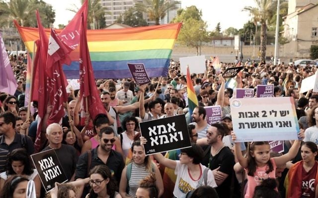Thousands protest in support of the right of LGBT couples to adopt children at a demonstration in Tel Aviv on July 20, 2017. (Tomer Neuberg/Flash90) Thousands protest in support of the right of LGBT couples to adopt children at a demonstration in Tel Aviv on July 20, 2017. (Tomer Neuberg/Flash90)
