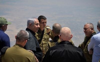 Prime Minister Benjamin Netanyahu (3rd L), Defense Minister Avigdor Liberman (L) and IDF Chief of Staff Gadi Eisenkot (2nd R) tour the northern border in the Golan Heights, on July 25, 2017. (Kobi Gideon/GPO/Flash90)