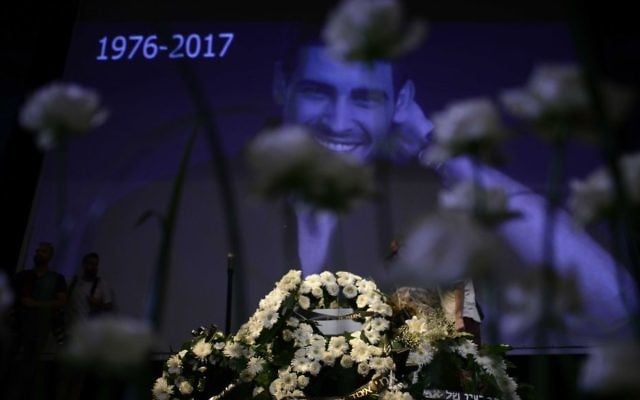 Friends, fans and family pay their respects at the funeral service of singer and director Amir Fryszer Guttman at Habima Theater in Tel Aviv on July 25, 2017. (Tomer Neuberg/Flash90) Friends, fans and family pay their respects at the funeral service of singer and director Amir Fryszer Guttman at Habima Theater in Tel Aviv on July 25, 2017. (Tomer Neuberg/Flash90)