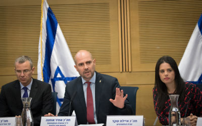 Justice Minister Ayelet Shaked (R), Tourism Minister Yariv Levin (L) and Likud Knesset Member Amir Ohana (C) attend a  committee meeting at the Knesset in Jerusalem on July 26, 2017. (Yonatan Sindel/Flash90)