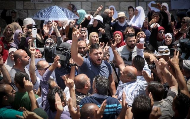 Muslims celebrate in Jerusalem's Old City, following Muslim leaders announcing it is OK to return to pray at the Temple Mount (Hadas Parush/FLASH90)