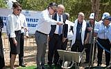 Cheryl Saban (left), Minister of Defense Avigdor Lieberman (center) and former Member of Knesset Shachiv Shanan (center, right) watch as Friends of the Israel Defense Forces National Board Member Haim Saban (center, left) breaks ground at the site of the new FIDF Druze Soldiers Heritage Center, July 2017 (Scally photography).