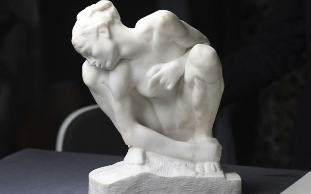 The sculpture 'Kauernde' (lit. 'Cowering') by Auguste Rodin (1840-1917) is on display during a press talk on the preparations of an exhibition of exemplary works from the art collection of Cornelius Gurlitt discovered in 2012, in November in Bonn, Germany, Tuesday June, 27, 2017. (Henning Kaiser/dpa via AP) The sculpture 'Kauernde' (lit. 'Cowering') by Auguste Rodin (1840-1917) is on display during a press talk on the preparations of an exhibition of exemplary works from the art collection of Cornelius Gurlitt discovered in 2012, in November in Bonn, Germany, Tuesday June, 27, 2017. (Henning Kaiser/dpa via AP)