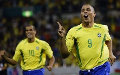 Brazilian soccer legend Ronaldo, right, after scoring a goal in a 2002 World Cup game between Brazil and Turkey played in Japan, June 26, 2002. (Alex Livesey/Getty Images via JTA)