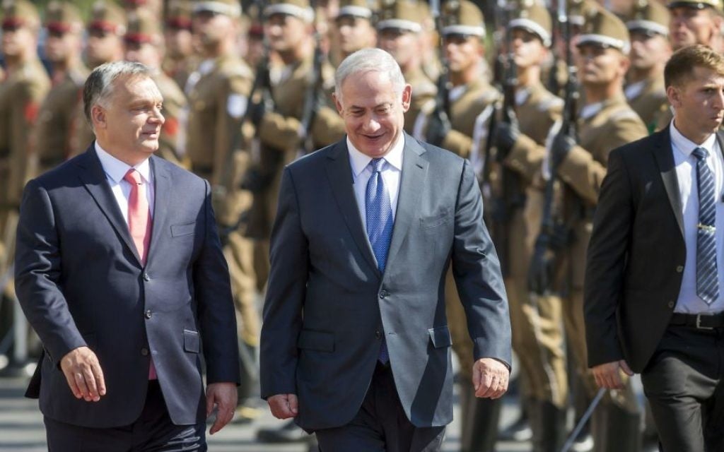 On a four-day official visit in Hungary, Prime Minister Benjamin Netanyahu, right, and his Hungarian counterpart Viktor Orban walk during the reception ceremony in front of the Parliament building in Budapest, Hungary, July 18, 2017. (Balazs Mohai/MTI via AP)