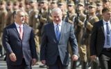 On a four-day official visit in Hungary, Prime Minister Benjamin Netanyahu, right, and his Hungarian counterpart Viktor Orban walk during the reception ceremony in front of the Parliament building in Budapest, Hungary, July 18, 2017. (Balazs Mohai/MTI via AP)