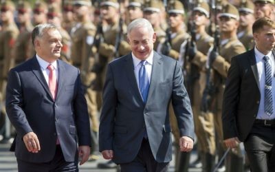 On a four-day official visit in Hungary, Prime Minister Benjamin Netanyahu, right, and his Hungarian counterpart Viktor Orban walk during the reception ceremony in front of the Parliament building in Budapest, Hungary, July 18, 2017. (Balazs Mohai/MTI via AP)