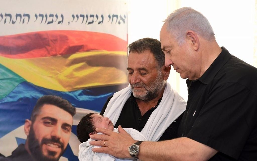 Prime Minister Benjamin Netanyahu visits the Shnaan family, whose son Kamil was killed in a July 14 attack on the Temple Mount, in the northern Druze town of Hurfeish, July 27, 2017. (GPO)