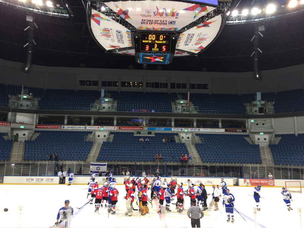 Russian (in red) and Israeli Maccabiah teams shaking hands after Sunday's match, which ended 5 to 3, Russia (Jessica Steinberg/Times of Israel) Russian (in red) and Israeli Maccabiah teams shaking hands after Sunday's match, which ended 5 to 3, Russia (Jessica Steinberg/Times of Israel)