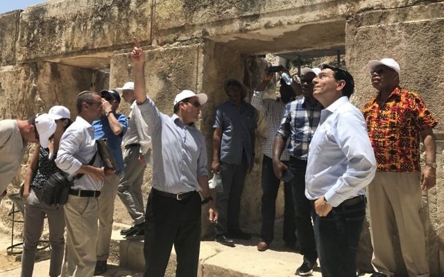 Jerusalem Mayor Nir Barkat, center, gestures as Israel's UN envoy Danny Danon, second right, looks on during a visit by UN ambassadors from nine countries who toured the City of David in Jerusalem, July 4, 2017. (Arnon Bossani and Frayda Leibtag) Jerusalem Mayor Nir Barkat, center, gestures as Israel's UN envoy Danny Danon, second right, looks on during a visit by UN ambassadors from nine countries who toured the City of David in Jerusalem, July 4, 2017. (Arnon Bossani and Frayda Leibtag)