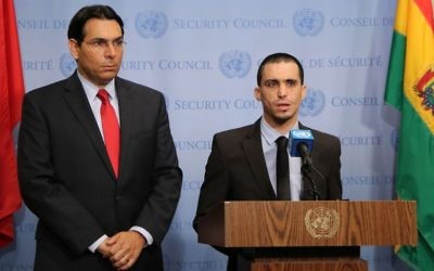 Israel's Ambassador to the UN Danny Danon and terror victim Oran Almog speak ahead of a Security Council meeting on July 25, 2017. (Dov Levi via Israel's mission to the UN)