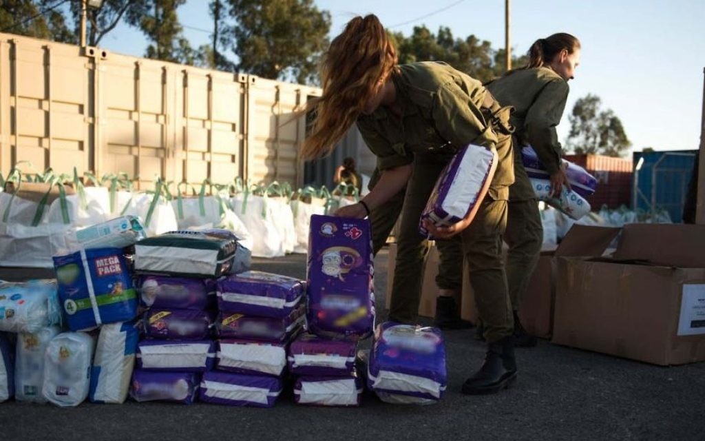 In this undated photo provided on July 19, 2017, IDF soldiers prepare humanitarian aid as part of the army's 'Good Neighbor' program for Syrian civilians on the Syrian Golan Heights. (Israel Defense Forces) In this undated photo provided on July 19, 2017, IDF soldiers prepare humanitarian aid as part of the army's 'Good Neighbor' program for Syrian civilians on the Syrian Golan Heights. (Israel Defense Forces)
