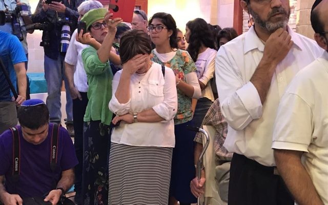 Members of the Salomon family attend the circumcision of their son, Ari, in the central Israel city of Elad, on July 27, 2017. (Jacob Magid/Times of Israel) Members of the Salomon family attend the circumcision of their son, Ari, in the central Israel city of Elad, on July 27, 2017. (Jacob Magid/Times of Israel)