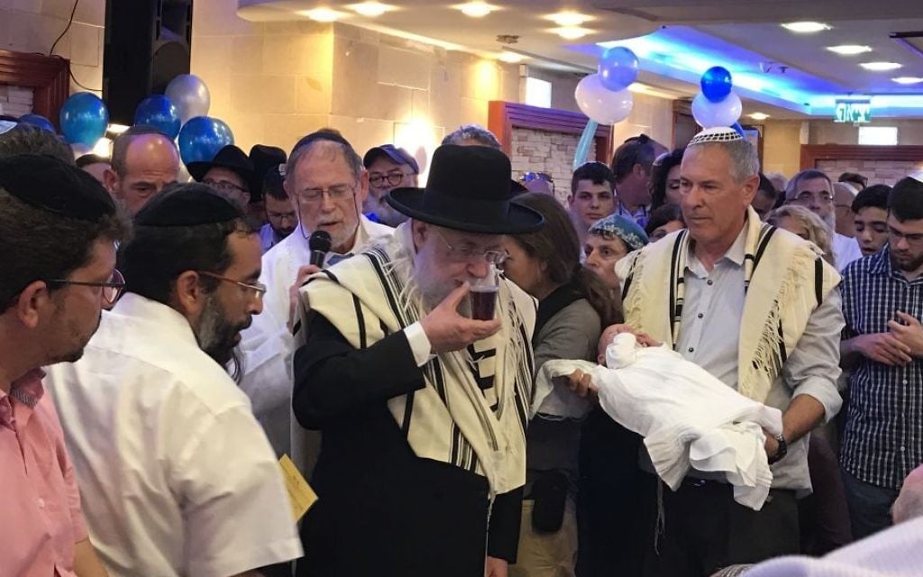 Members of the Salomon family attend the circumcision of their son, Ari, in the central Israel city of Elad, on July 27, 2017. (Jacob Magid/Times of Israel) Members of the Salomon family attend the circumcision of their son, Ari, in the central Israel city of Elad, on July 27, 2017. (Jacob Magid/Times of Israel)