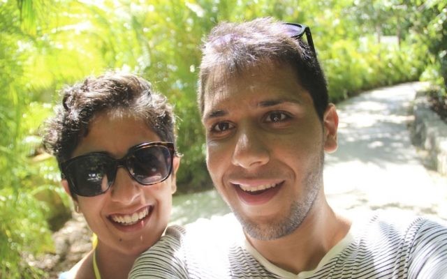 This August, 2015 self-portrait provided by Hesam Mostafavi shows him and his fiancee Mina Jafari on vacation in Playa del Carmen, Mexico. (Hesam Mostafavi via AP)