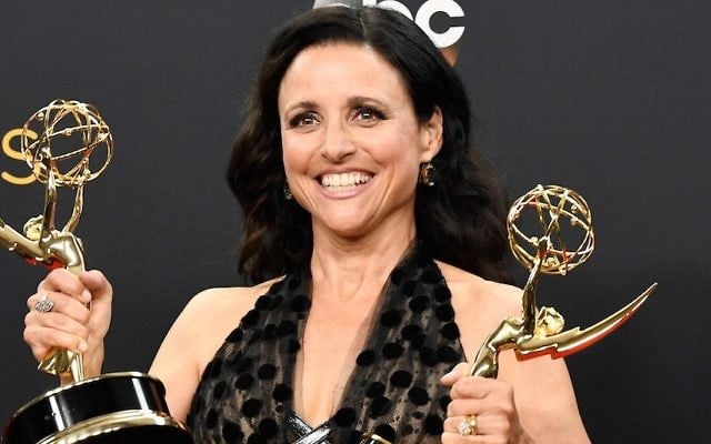 Julia Louis-Dreyfus shows off the Emmy Awards for best actress in a comedy series and best comedy series for “Veep” at the Primetime Emmy Awards in Los Angeles, Sept. 18, 2016. (Frazer Harrison/Getty Images) 