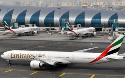 In this March 22, 2017 file photo, an Emirates plane taxis to a gate at Dubai International Airport in Dubai, United Arab Emirates. (AP Photo/Adam Schreck, File)
