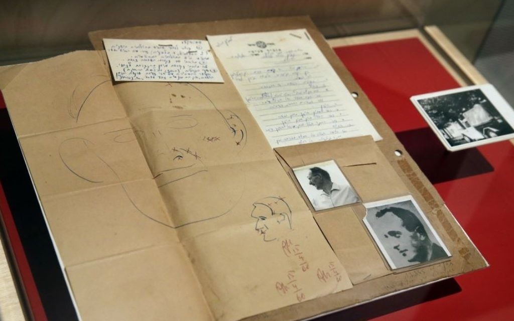 The 1960 forensic crime lab file comparing photos of Adolf Eichmann in World War II and as Ricardo Klement in Argentina, are displayed in the "Operation Finale: The Capture & Trial of Adolf Eichmann" exhibit at the Museum of Jewish Heritage, in New York, Friday, July 14, 2017. (AP Photo/Richard Drew)