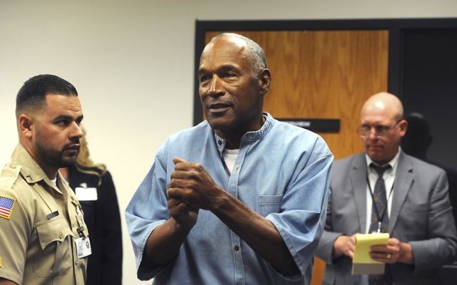 Former NFL football star O.J. Simpson reacts after learning he was granted parole at Lovelock Correctional Center in Lovelock, Nevada, July 20, 2017. (Jason Bean/The Reno Gazette-Journal via AP) Former NFL football star O.J. Simpson reacts after learning he was granted parole at Lovelock Correctional Center in Lovelock, Nevada, July 20, 2017. (Jason Bean/The Reno Gazette-Journal via AP)