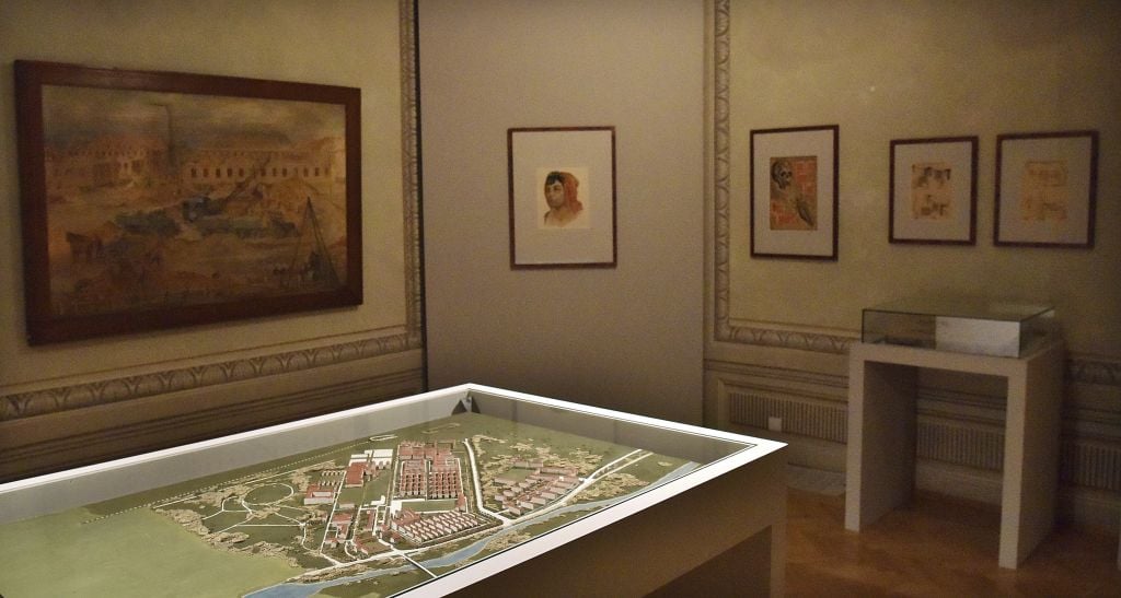 A model of a plan the German Nazis were making for the enlargement of the Auschwitz death camp on display at the 'Face to Face. Art in Auschwitz' exhibition of art by the inmates, shwon at the Szolayski house in Krakow, Poland, July 12,2017. (Bartosz Bartyzel/Auschwitz Museum via AP)