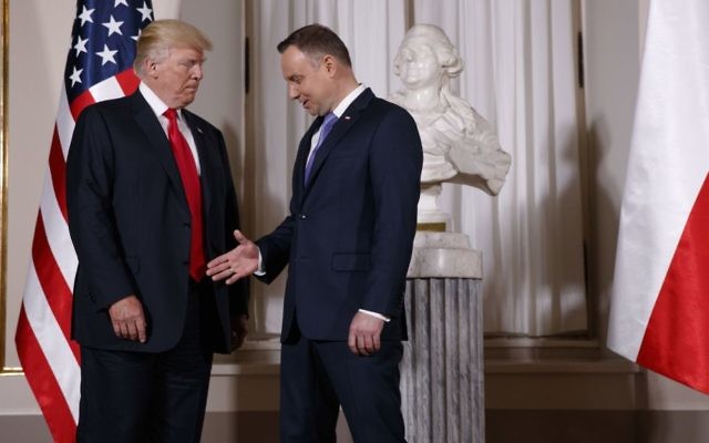 US President Donald Trump, left, is greeted by Polish President Andrzej Duda after arriving at the Royal Castle, Thursday, July 6, 2017, in Warsaw. (AP Photo/Evan Vucci) US President Donald Trump, left, is greeted by Polish President Andrzej Duda after arriving at the Royal Castle, Thursday, July 6, 2017, in Warsaw. (AP Photo/Evan Vucci)