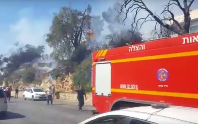 Illustrative: Firefighters battle a fire in the northern city of Safed on July 16, 2017. (Screen capture: YouTube) Illustrative: Firefighters battle a fire in the northern city of Safed on July 16, 2017. (Screen capture: YouTube)