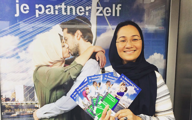 Shirin Musa handing out fliers in Rotterdam featuring images from the poster campaign on free choice of partners, May 25, 2017. (Courtesy of Femme for Freedom)