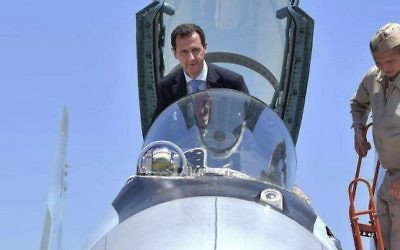 Syrian President Bashar Assad climbing into the cockpit of a Russian SU-35 fighter jet as he inspects the Russian Hmeimim air base in the province of Latakia, Syria, June 27, 2017 (Syrian Presidency via AP, File)