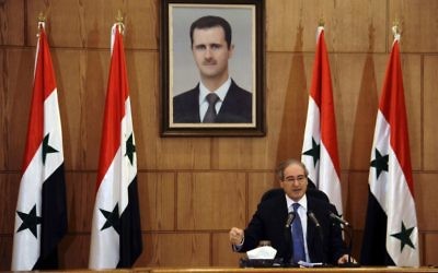 Syrian Deputy Foreign Minister Faisal Mekdad speaks during a press conference in Damascus, Syria, July 3, 2017. (SANA via AP)