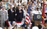 US President Donald Trump stands for the colors as he arrives during the commissioning ceremony of the aircraft carrier USS Gerald R. Ford (CVN 78) at Naval Station Norfolk, Va., Saturday, July, 22, 2017. (AP Photo/Carolyn Kaster)