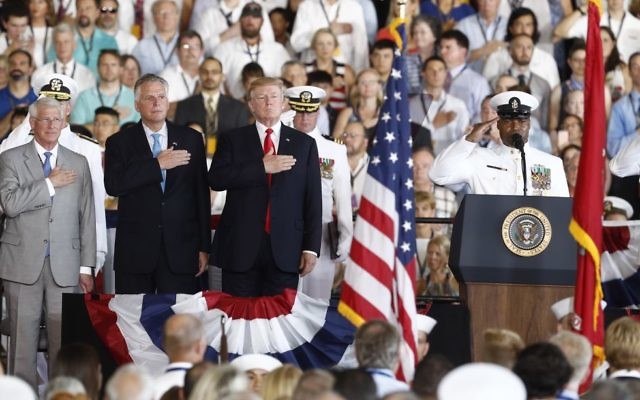 US President Donald Trump stands for the colors as he arrives during the commissioning ceremony of the aircraft carrier USS Gerald R. Ford (CVN 78) at Naval Station Norfolk, Va., Saturday, July, 22, 2017. (AP Photo/Carolyn Kaster) US President Donald Trump stands for the colors as he arrives during the commissioning ceremony of the aircraft carrier USS Gerald R. Ford (CVN 78) at Naval Station Norfolk, Va., Saturday, July, 22, 2017. (AP Photo/Carolyn Kaster)
