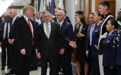 US President Donald Trump and US Vice President Mike Pence walk with Defense Secretary James Mattis, center, to begin greeting military personnel during their visit to the Pentagon, Thursday, July 20, 2017. (AP Photo/Pablo Martinez Monsivais)