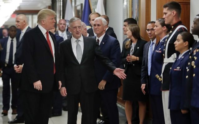 US President Donald Trump and US Vice President Mike Pence walk with Defense Secretary James Mattis, center, to begin greeting military personnel during their visit to the Pentagon, Thursday, July 20, 2017. (AP Photo/Pablo Martinez Monsivais) US President Donald Trump and US Vice President Mike Pence walk with Defense Secretary James Mattis, center, to begin greeting military personnel during their visit to the Pentagon, Thursday, July 20, 2017. (AP Photo/Pablo Martinez Monsivais)
