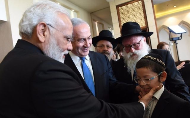 Indian Prime Minister Narendra Modi on July 5, 2017 meets with Moshe Holtzberg, the now 12-year-old son of two Chabad emissaries who were killed in a 2008 terror attack in Mumbai. (Haim Tzach, GPO) Indian Prime Minister Narendra Modi on July 5, 2017 meets with Moshe Holtzberg, the now 12-year-old son of two Chabad emissaries who were killed in a 2008 terror attack in Mumbai. (Haim Tzach, GPO)