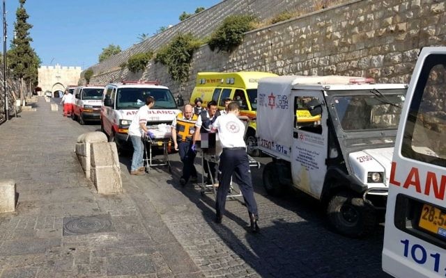 Medics treat victims of a shooting attack on the Temple Mount in Jerusalem's Old City on July 14, 2017. (Magen David Adom) Medics treat victims of a shooting attack on the Temple Mount in Jerusalem's Old City on July 14, 2017. (Magen David Adom)