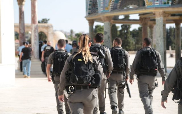 Border Police officers walk on the Temple Mount after a shooting attack in the area left three people injured, two of them seriously, on July 14, 2017. (Israel Police) Border Police officers walk on the Temple Mount after a shooting attack in the area left three people injured, two of them seriously, on July 14, 2017. (Israel Police)