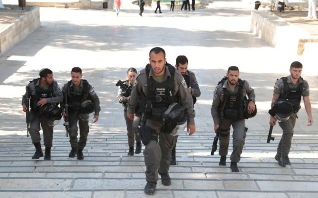 Border Police officers walk on the Temple Mount after a shooting attack in the area left three people injured, two of them seriously, on July 14, 2017. (Israel Police) Border Police officers walk on the Temple Mount after a shooting attack in the area left three people injured, two of them seriously, on July 14, 2017. (Israel Police)