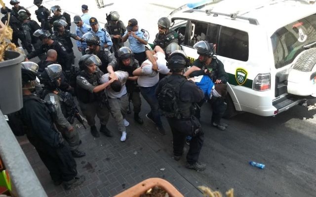 Israeli security forces arrest a Palestinian rioter in Wadi Joz, near the Old City of Jerusalem, July 21, 2017. (Judah Ari Gross/Times of Israel)